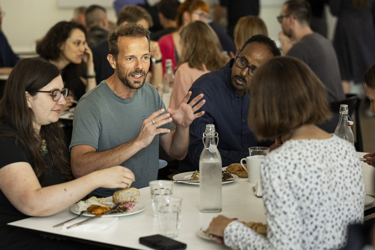 Cross-disciplinary conversation in the AIAS Hall.